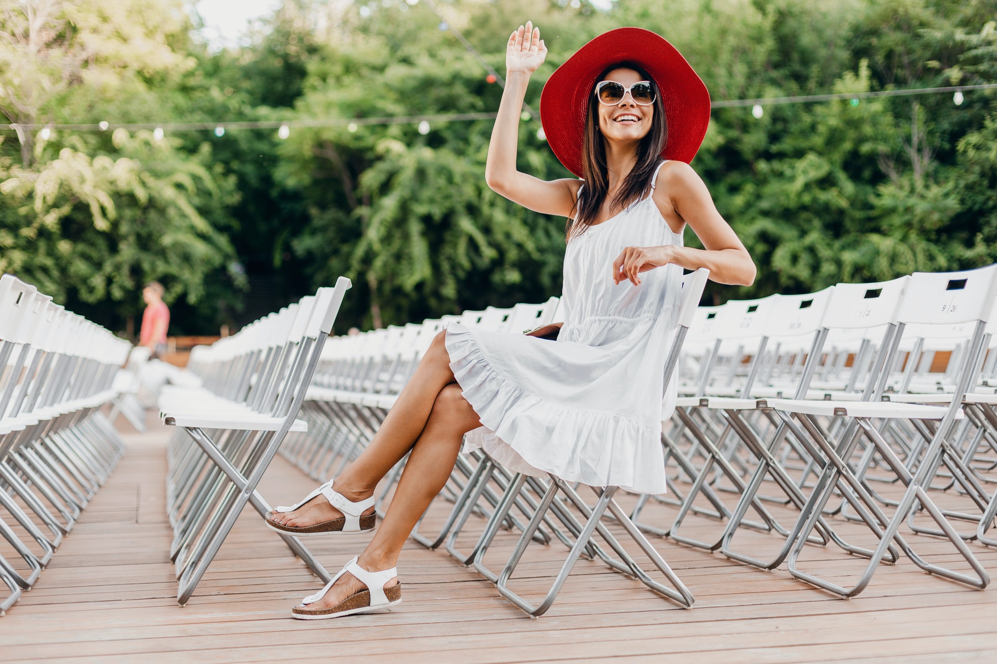 attractive happy smiling woman dressed in white dress